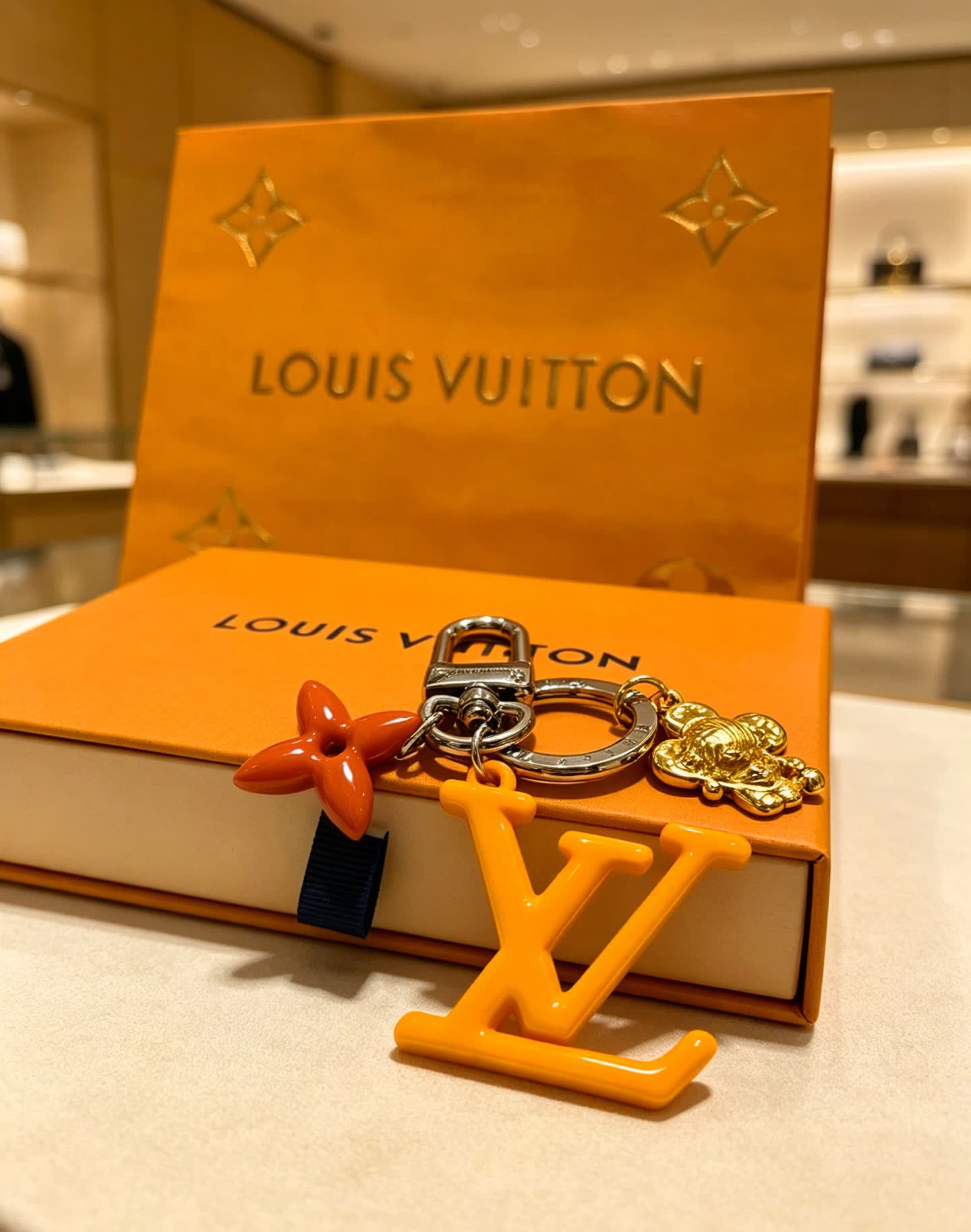 Louis Vuitton Keychain with LV Logo and Monogram Motif